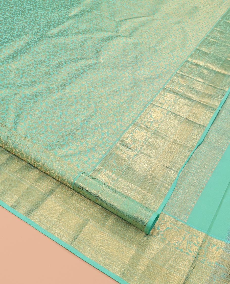 Turquoise Kanchipuram Wedding Silk Saree, Decorated with Jacquard Design, a Traditional Zari Border, Grand Pallu, and a Matching Blouse