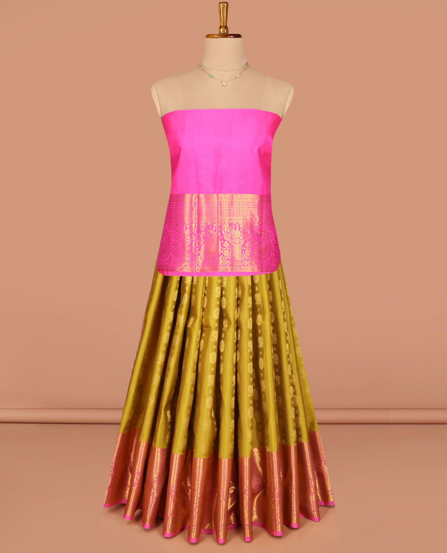 Green Pure Silk Half-Saree, Adorned with Mayil-Chakram Buttas All Over Its Skirt, Complemented by Contrast Border of Puli Nagam, Jaal, and Arumbu Manga Designs, Paired with a Contrast Blouse, and Comes with a Zari Design Woven Dhavani