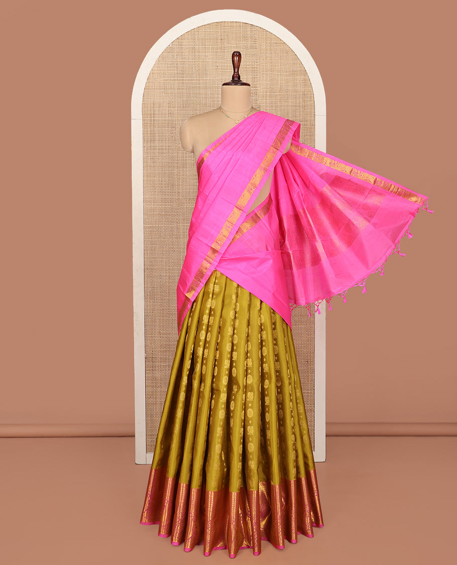 Green Pure Silk Half-Saree, Adorned with Mayil-Chakram Buttas All Over Its Skirt, Complemented by Contrast Border of Puli Nagam, Jaal, and Arumbu Manga Designs, Paired with a Contrast Blouse, and Comes with a Zari Design Woven Dhavani