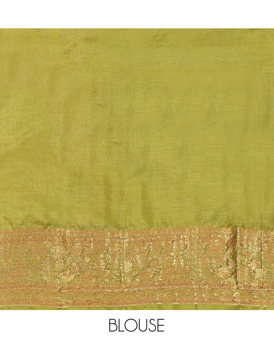 Green Tussar Silk Saree Features Zari Buttas, Highlighted by a Zari Border, Intricately Designed Pallu, and a Matching Blouse