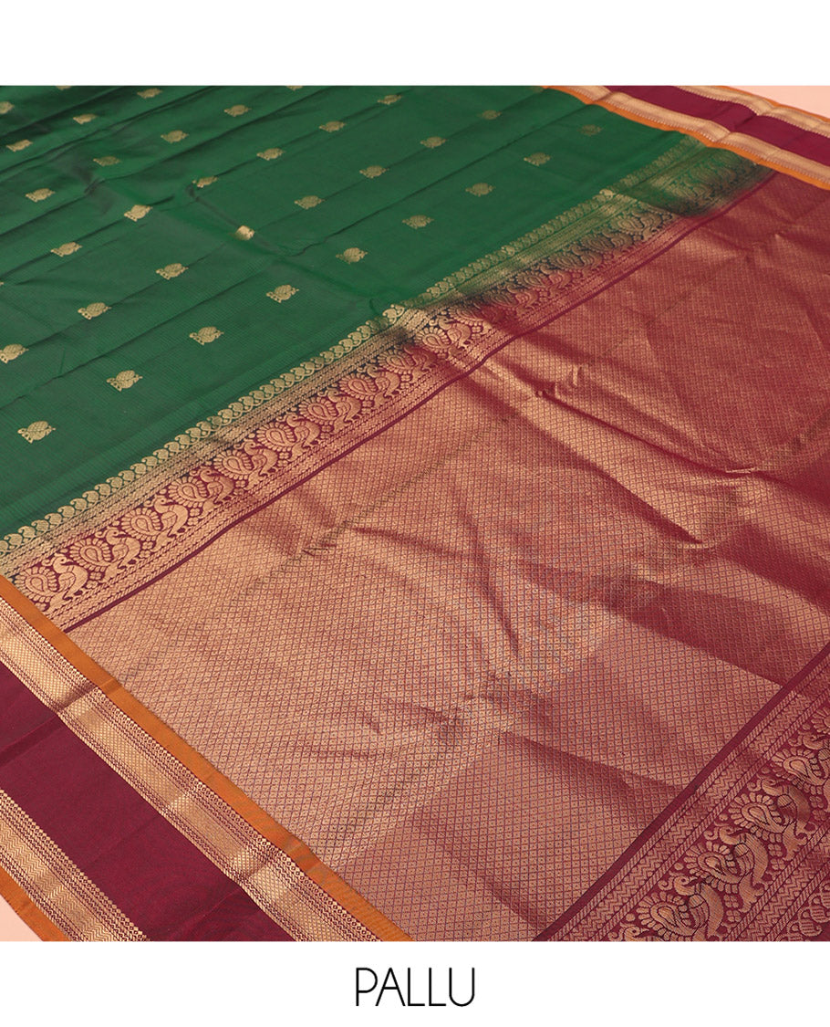 Green Vasundhara Lite Silk Mix Saree Features Mayil Buttas and Stripes, a Contrast Rettai Pettu Border of Salngai, Banaras, Neli, Kuyil, Kann, and Vanki Designs, Mayil Kann Pallu, and a Contrast Blouse