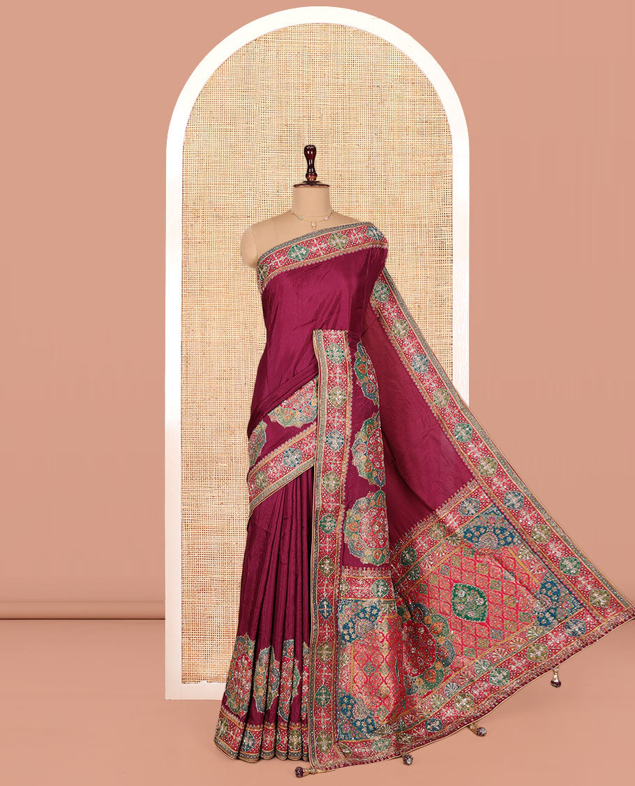 Wine Dola Silk Saree, Embellished with Rangoli-Style Colorful Embroidery on Its Body, Highlighted by an Embroidered Border, Pallu of Embroidery and Print Work, and Paired with a Matching Blouse