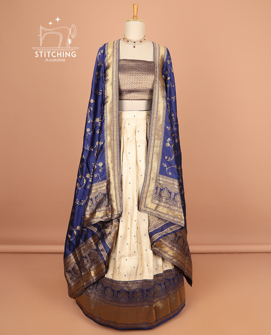 Cream buttas half saree with contrast zari design border, zari design blouse & floral vine zari design dhavani