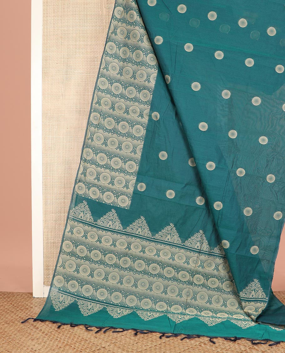 Green Coimbatore Cotton Saree, Beautified with Circle Buttas All Over Its Body, Subtly Made Border Steeped with Circle Designs, Pallu Mirrors the Same Body Design, and Paired with a Matching Blouse
