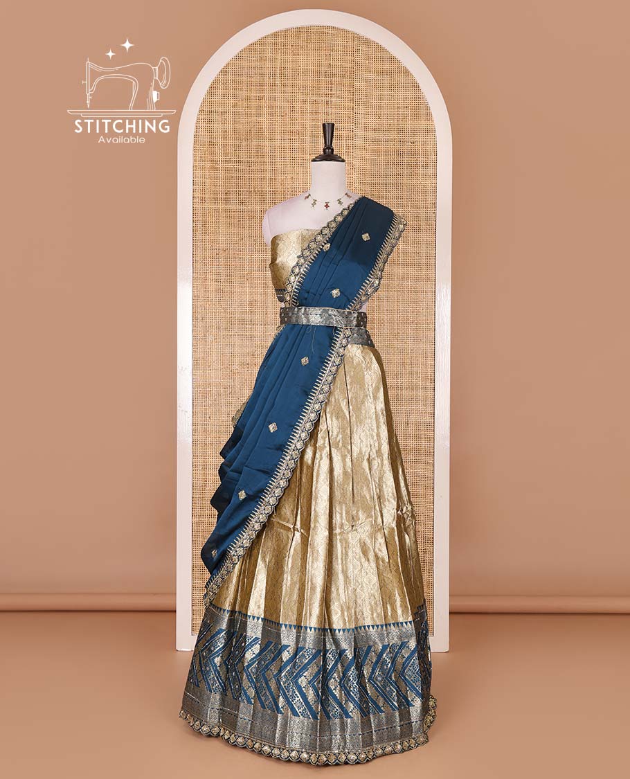 Gold banaras half saree, ogee skirt, contrast peacock blue traditional zari border, matching blouse, and Syska georgette embroidered dhavani