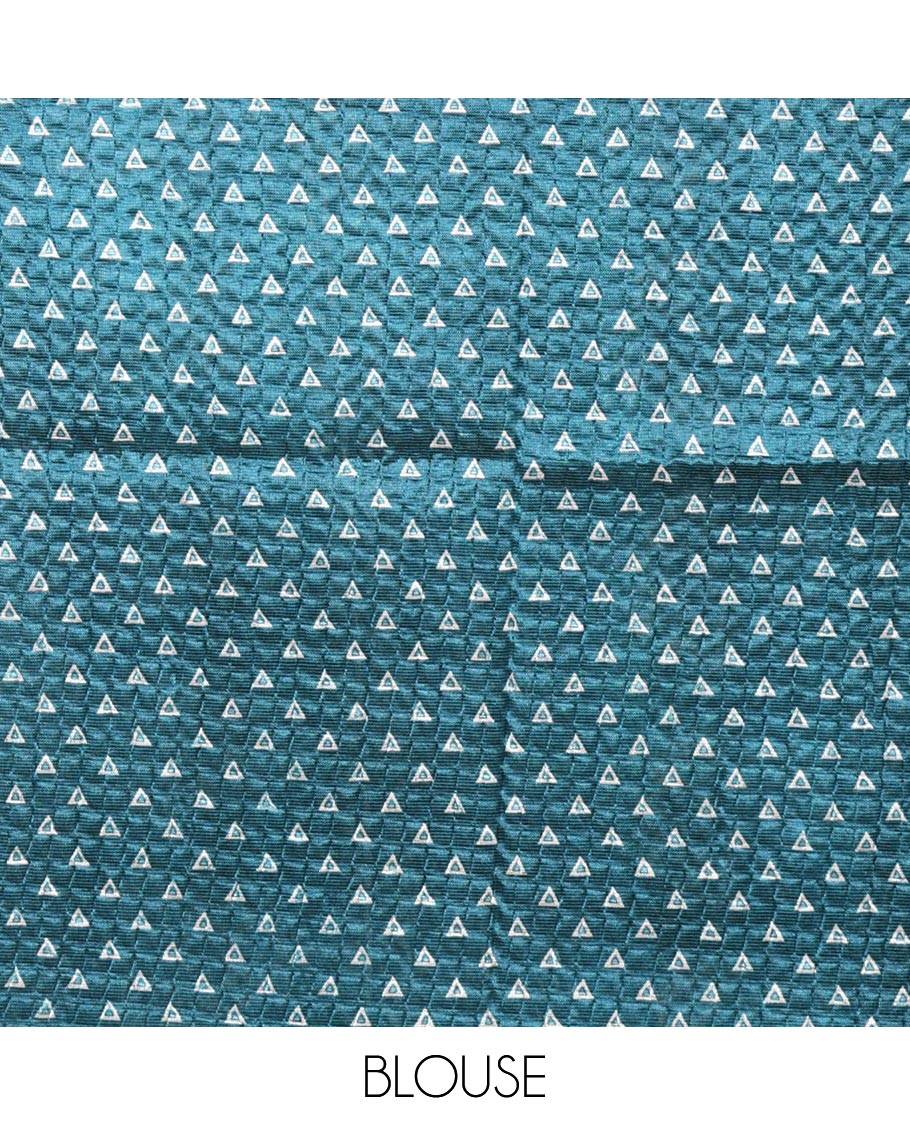 Blue batik-style warli printed Litch crushed saree, batik chevron border, floral-geometric printed pallu & triangle motif blouse