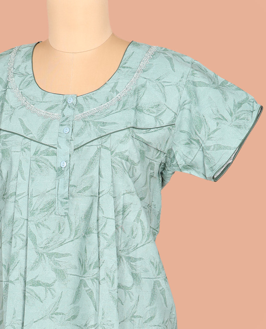 Green-Shade Cotton Nighty Subtly Adorned with Floral Patterns Print, Featuring Lace Work, Round Front Neck, and Half Sleeves