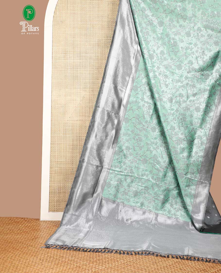Green with grey fancy zari weaving design litchi silk saree with contrast jacquard border & weaving rich pallu along with butta zari design blouse