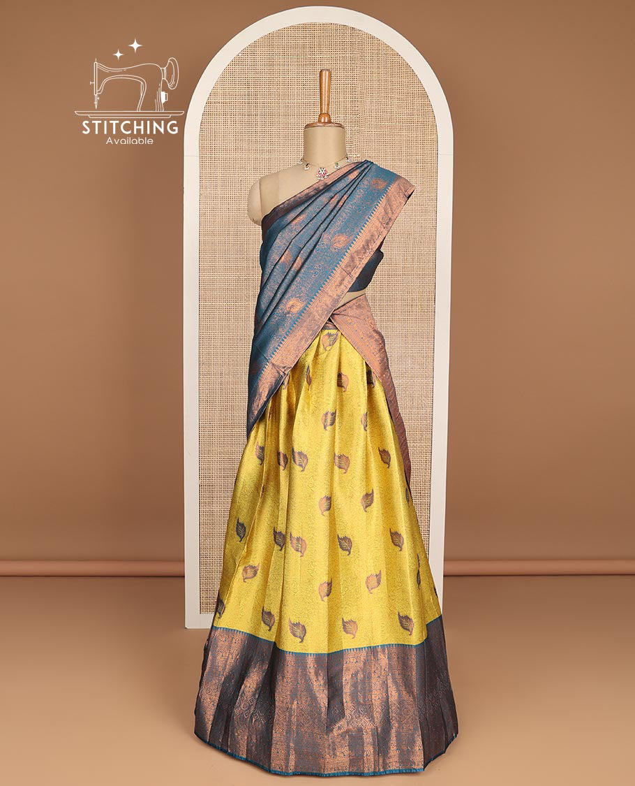 Mustard floral jacquard tissue half saree with contrast zari design border, zari design blouse & floral zari design dhavani