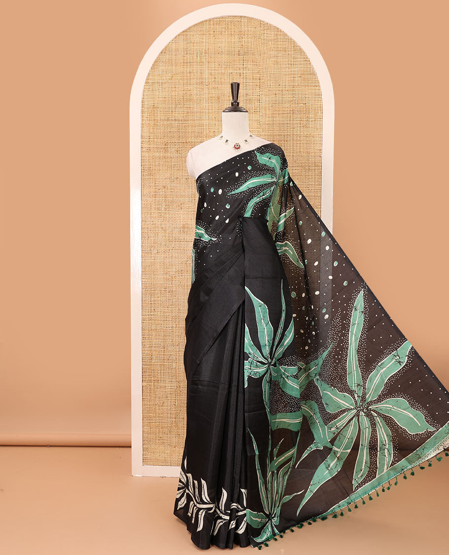 Black-base plain body khadi cotton saree with batik-style green-color floral & dots printed on its border & pallu, plain black blouse