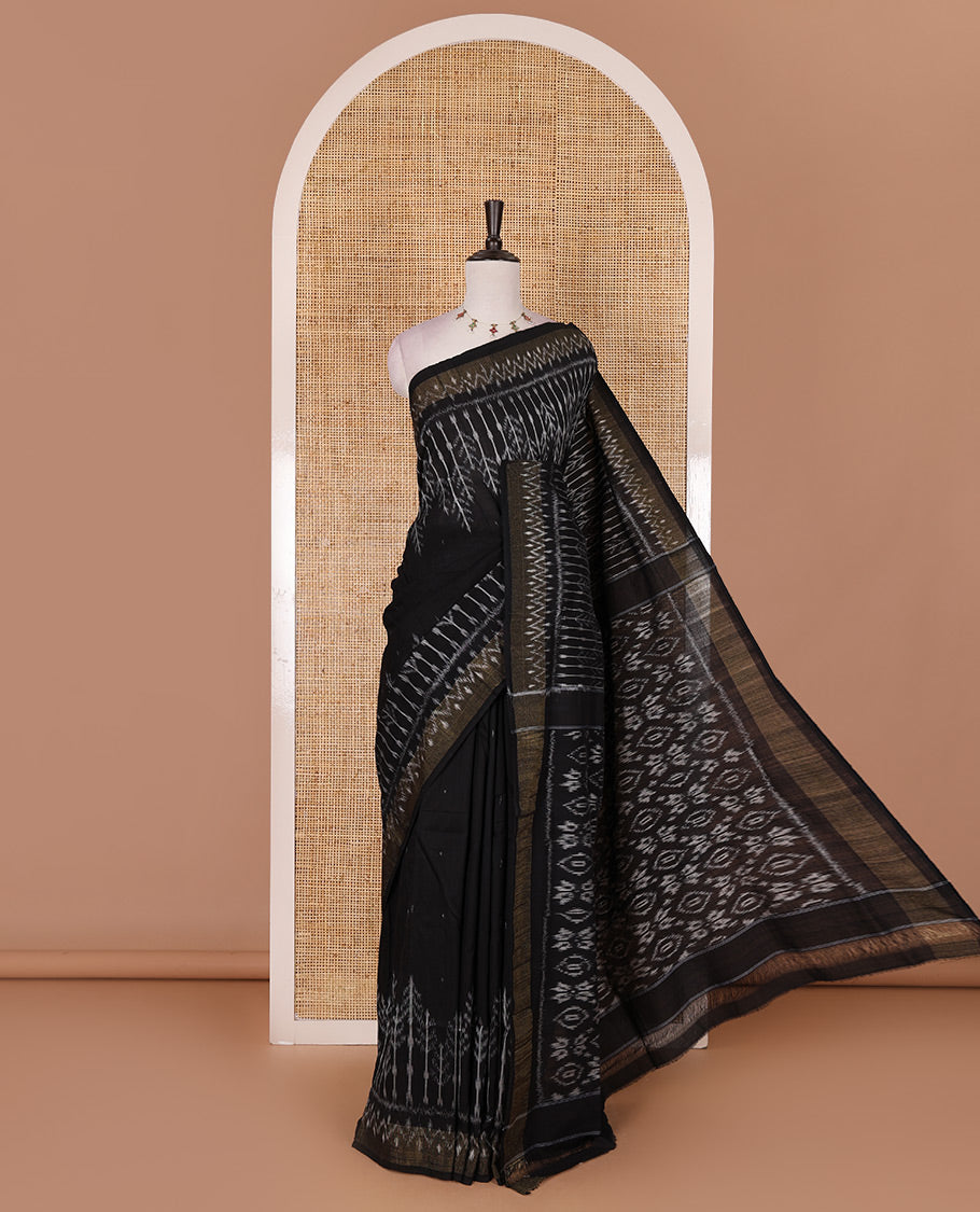 Black buttas and floral like ikkat woven ikkat cotton saree, zari bavanji border, ikkat design pallu, and plain blouse