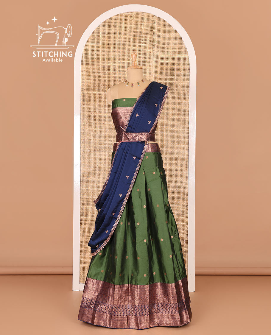 Green taffeta silk half-saree, flower zari buttas and contrast traditional zari bordered skirt, a matching blouse, and contrast embroidered satin georgette scallop dhavani