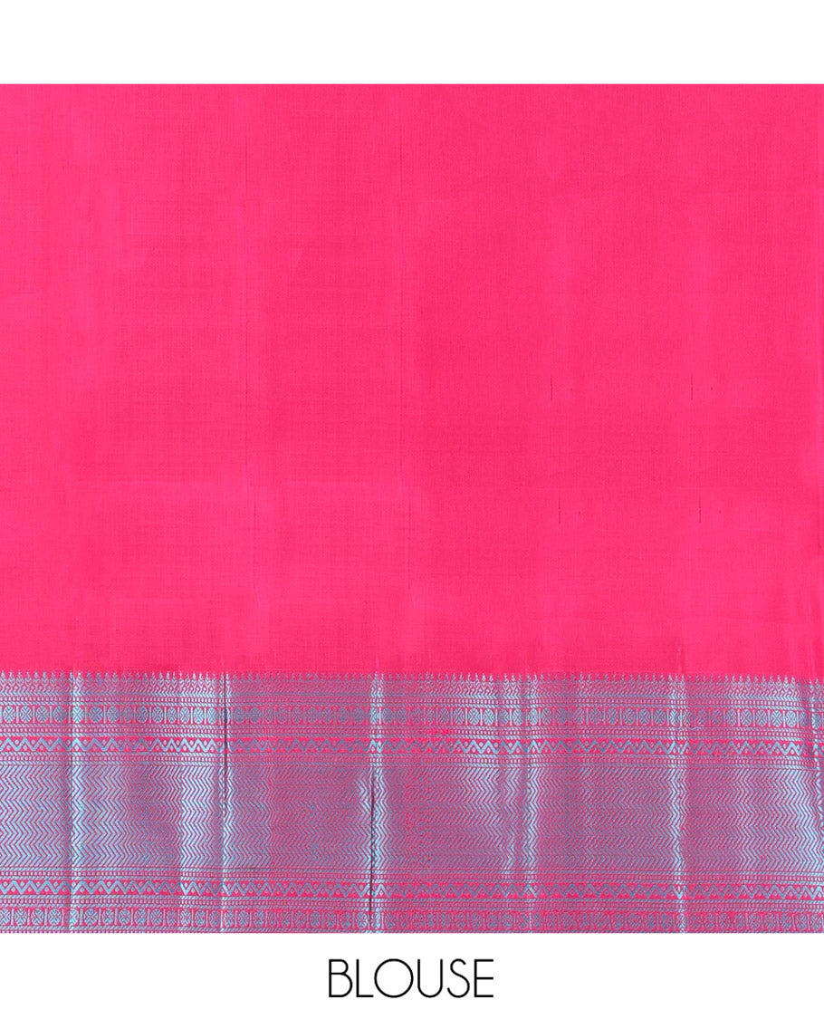 Wine Kanchipuram Silk Saree, Adorned with Mayil-Chakram Buttas All Over Its Body, Complemented by a Contrast Border of Thilakam, Banaras, Muthu, Rudraksham, Neli, and Vanki Designs, and Pallu Steeped with Kamalam Designs, and Paired with a Contrast Blouse