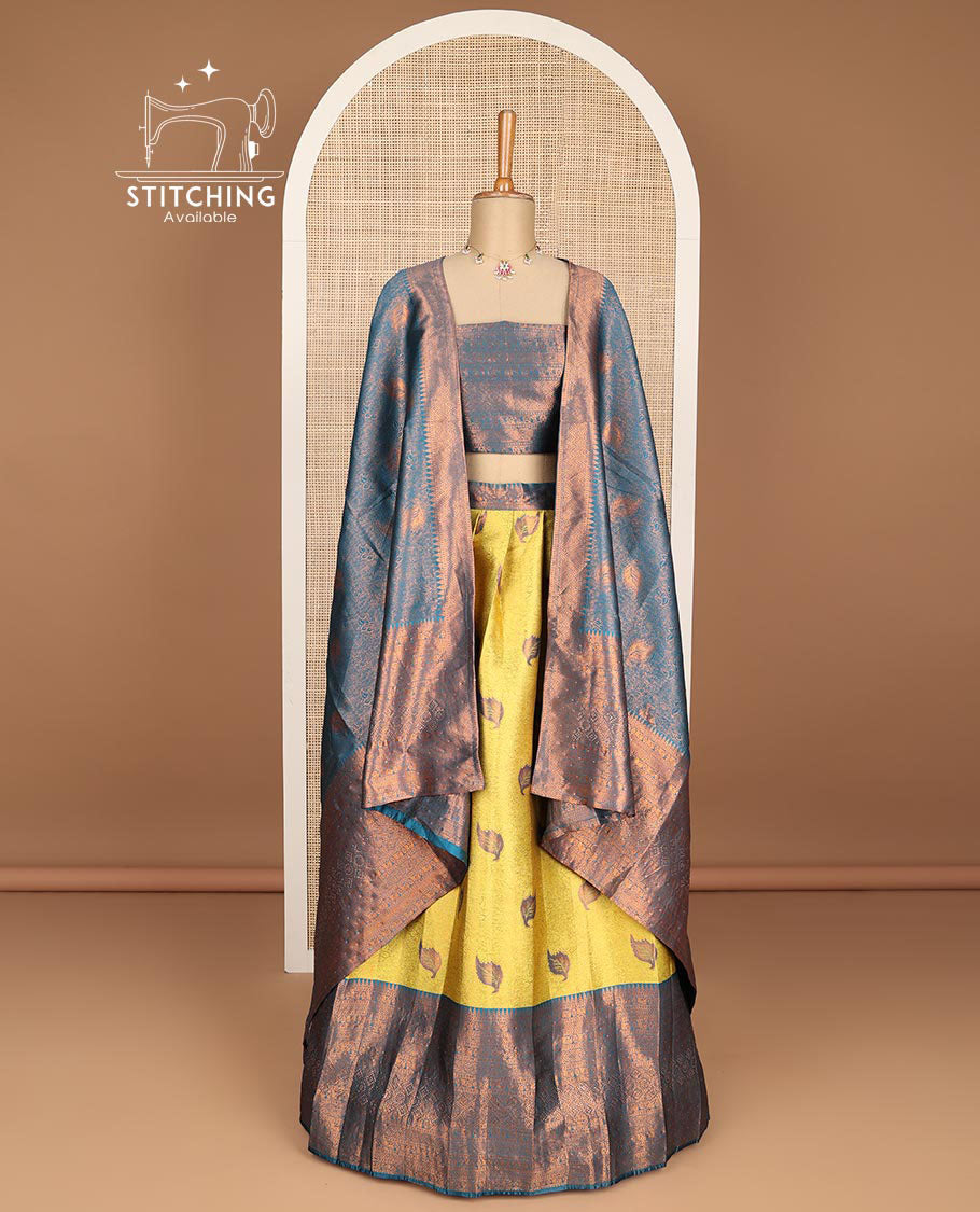 Mustard floral jacquard tissue half saree with contrast zari design border, zari design blouse & floral zari design dhavani