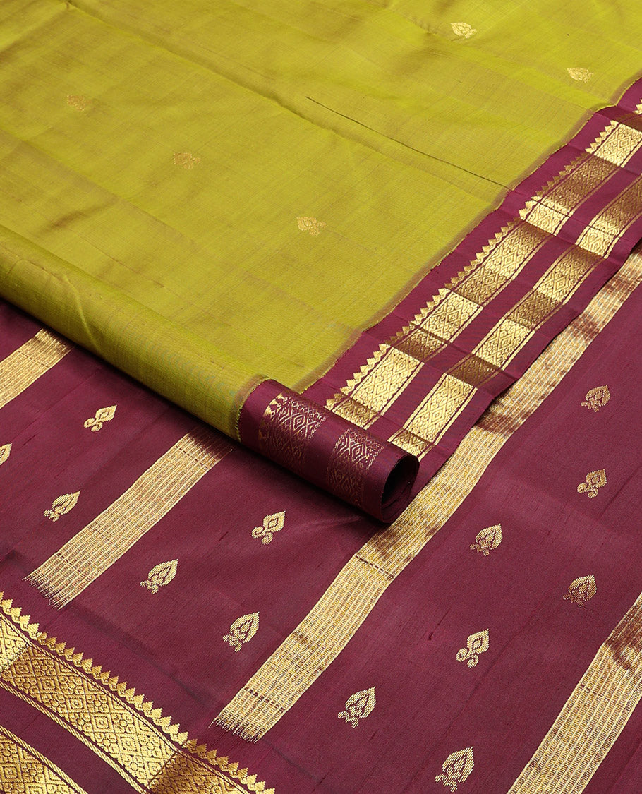 Green floral buttas kancheepuram silk saree with contrast korvai border of thilakam mokku, banaras, checked design & zari design pallu