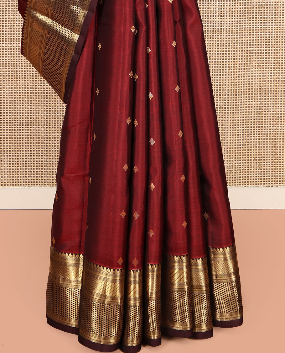 Red Vasundhara Lite Silk Mix Saree, Bedecked with Zari Buttas, a Contrast Border of Thilakam Mokku, Mayil Kann, and Ara Maadam, Grand Pallu, and a Contrast Blouse