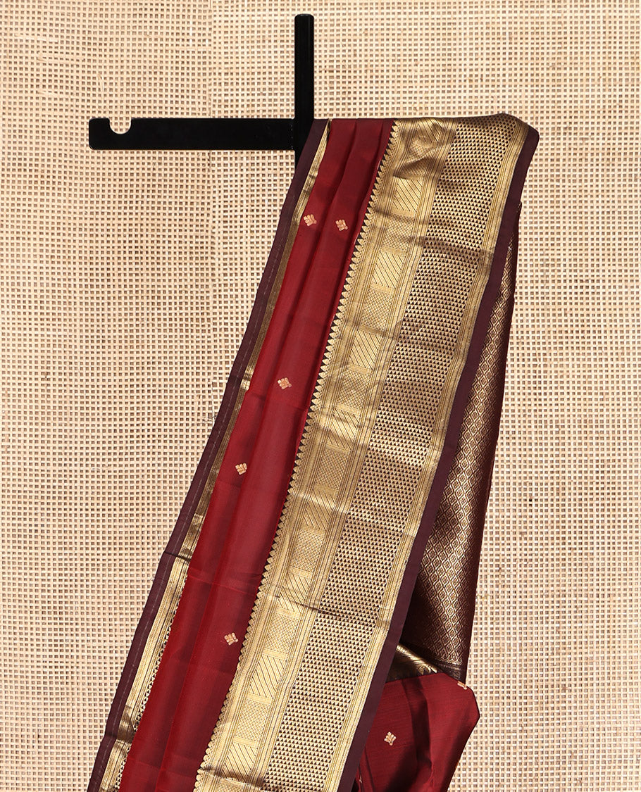 Red Vasundhara Lite Silk Mix Saree, Bedecked with Zari Buttas, a Contrast Border of Thilakam Mokku, Mayil Kann, and Ara Maadam, Grand Pallu, and a Contrast Blouse