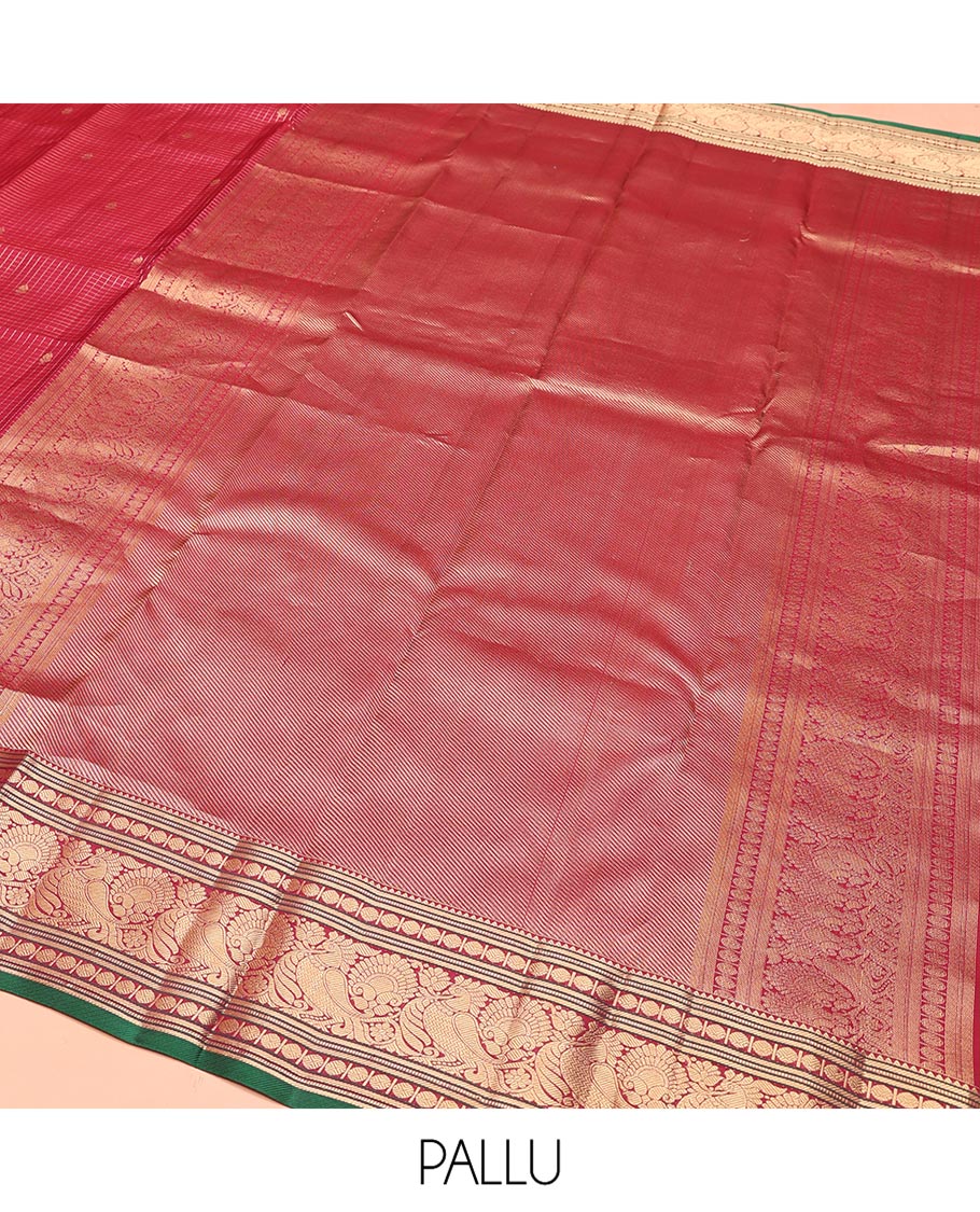 Reddish Pink Vasundhara Silk Saree, Majestically Detailed with Zari Buttas and Micro-Checks on Its Body, Highlighted by Zari Border of Rekku, Muthu, Banaras, Rudraksham, and Mayil Designs, Diagonally Striped Pallu, and Paired with a Contrast Blouse