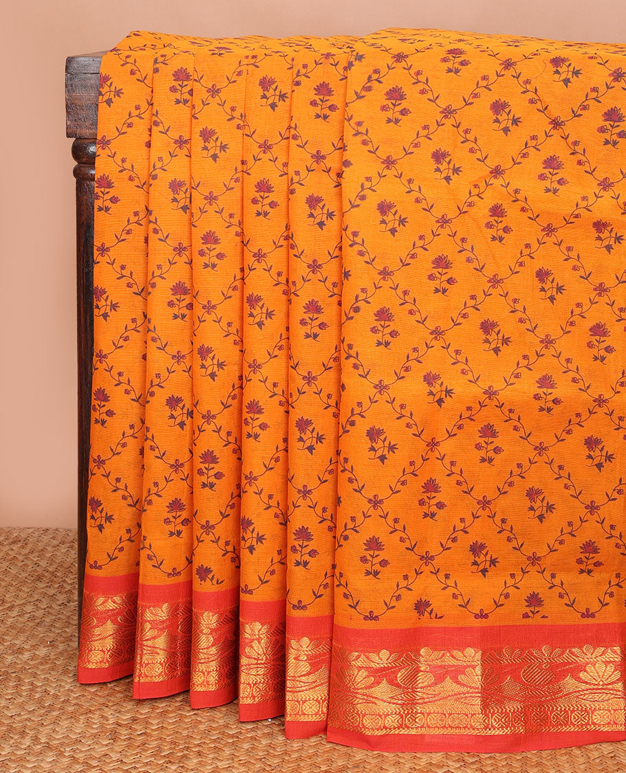Orange floral jaal printed Andhra cotton saree, contrast traditional zari motif border & zari pallu of paisleys