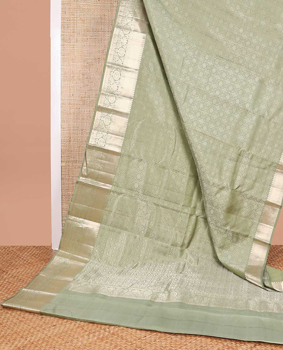 Green checked floral design kancheepuram silk saree with self border of thilakam mokku, kathir, paun design & floral pallu