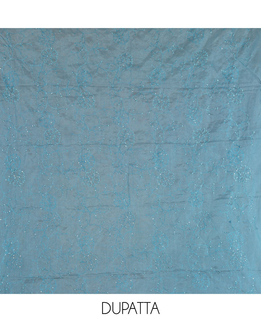 Blue churidar material set, floral print with thread outlined organza top, plain santoon bottom, and floral vine sequins embroidered organza dupatta