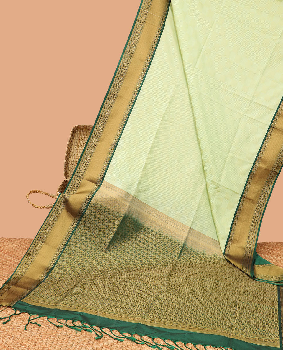 Mint green checked soft silk saree with contrast intricate zari design & argyle design pallu