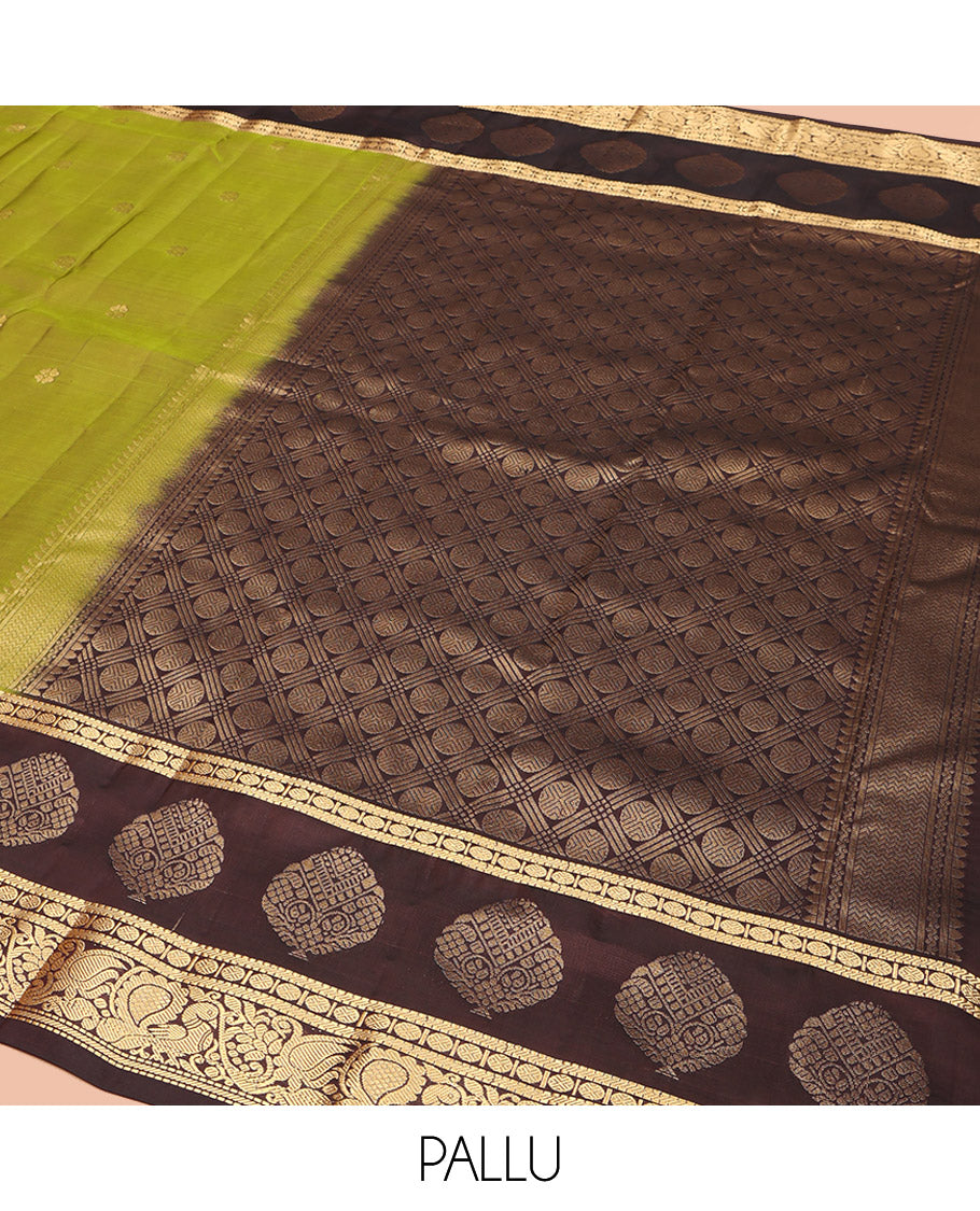 Green Vasundhara Lite Silk Mix Saree, Woven with Zari Buttas, Complemented by a Contrast Border of Muthu, Banaras, Rudraksham, and Mayil Designs, Pallu Elevated with Rudraksham Butta Enclosed Jaal Designs, and Paired with a Contrast Blouse
