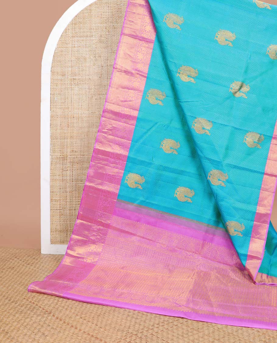 Light blue checked, mayil buttas silk saree with contrast border of thilakam mokku, muthu, paun design & floral design pallu