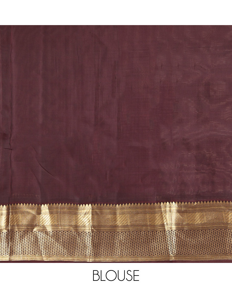 Red Vasundhara Lite Silk Mix Saree, Bedecked with Zari Buttas, a Contrast Border of Thilakam Mokku, Mayil Kann, and Ara Maadam, Grand Pallu, and a Contrast Blouse