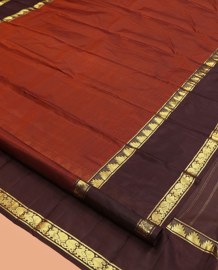 Dark Rust Plain Kanchipuram Silk Saree, a Contrast Rettai Pettu Border of Thazampoo Rekku, Mayil, and Maga Designs, Zari Striped Pallu, and a Contrast Blouse