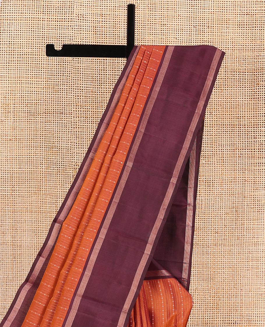 Orange zari design Kanchipuram silk saree, contrast rettai pettu zari striped border, and jaal patterned pallu
