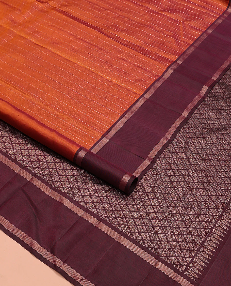 Orange zari design Kanchipuram silk saree, contrast rettai pettu zari striped border, and jaal patterned pallu