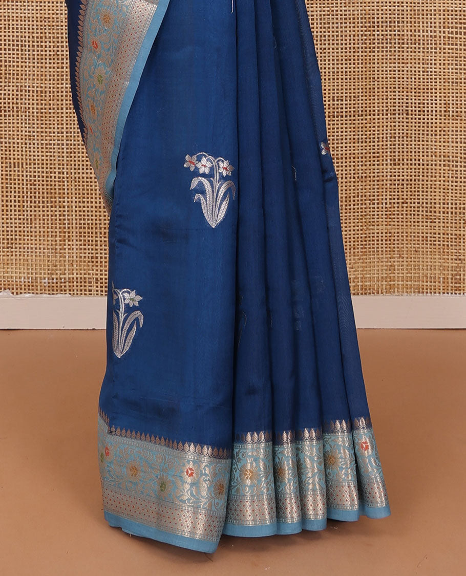 Blue floral buttas raw mango silk saree, contrast traditional zari design border, and intricate pallu