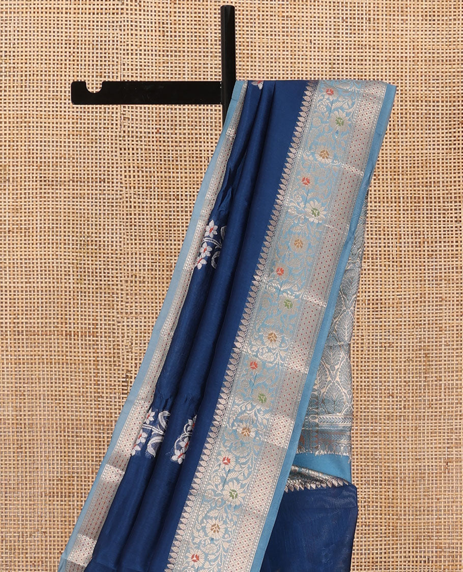 Blue floral buttas raw mango silk saree, contrast traditional zari design border, and intricate pallu