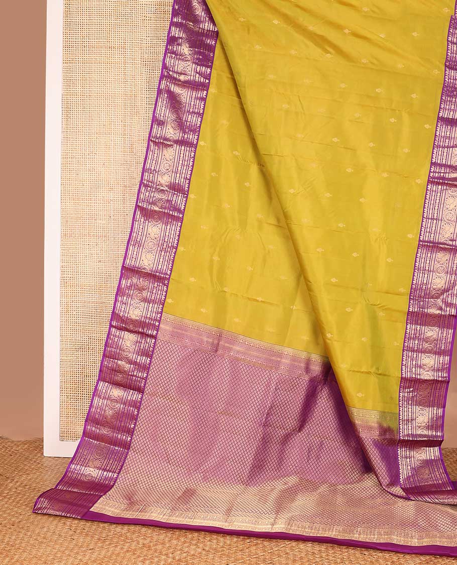 Green zari buttas silk saree, contrast border of thilakam manga mokku, rudraksham,cross neli, and annam chakram, and jaal pallu