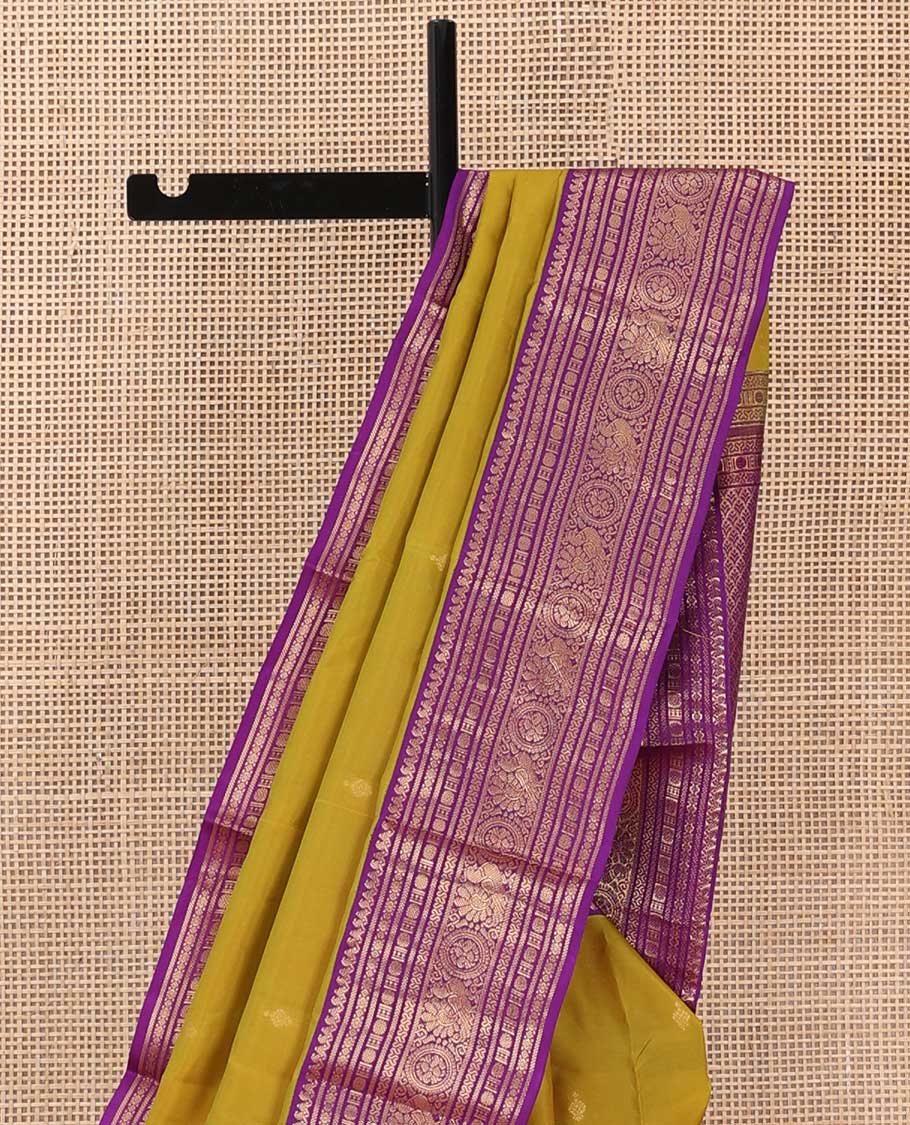 Green zari buttas silk saree, contrast border of thilakam manga mokku, rudraksham,cross neli, and annam chakram, and jaal pallu