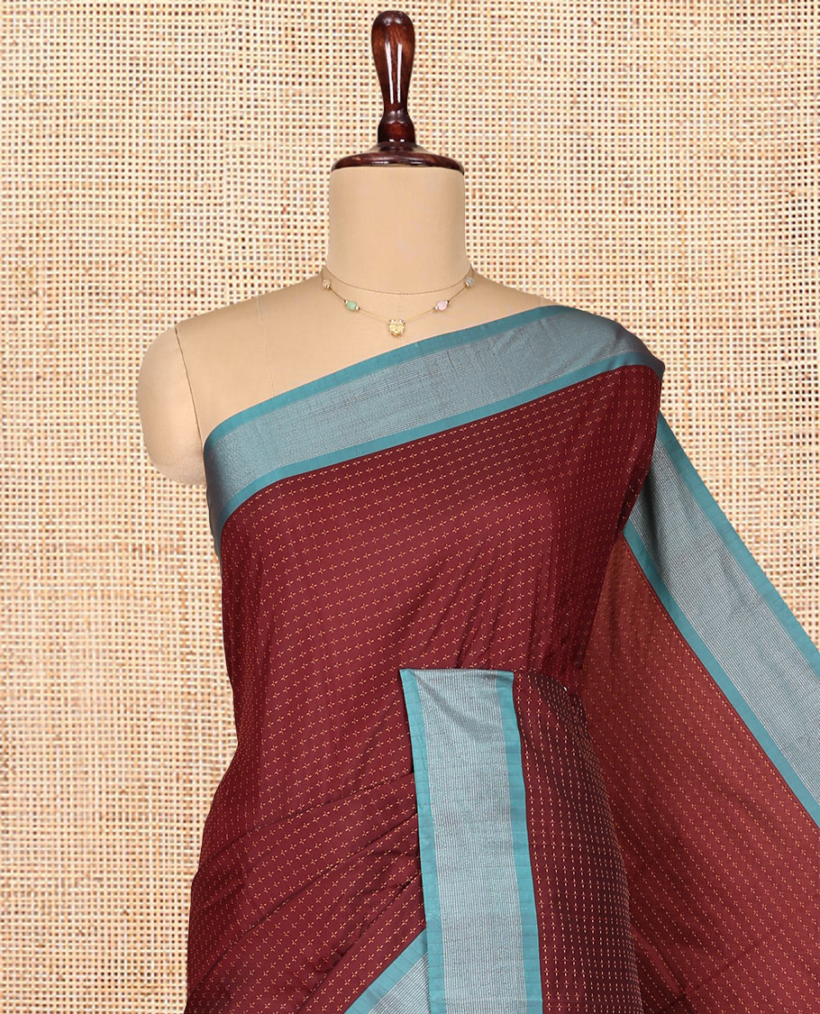 Maroon Aarani Gift Saree, Adorned with Plus-Shaped Buttas on Its Body, Complemented by a Contrast Striped Border, Subtle Striped Pallu, and Paired with a Matching Blouse