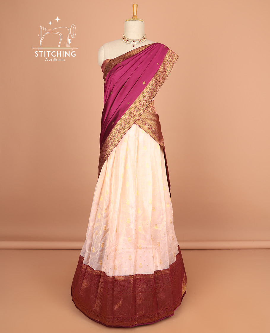 Light pink buttas half saree with contrast zari design border, zari design blouse & floral vine zari design dhavani