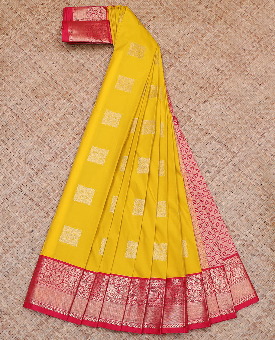 Yellow Budget Silk Saree, Sparsely Sparkled with Buttas All Over Its Body, Complemented by a Contrast Traditional Zari Border of Paisley Designs, Pallu of Rudraksham Butta Enclosed Jaal, and Paired with a Contrast Blouse