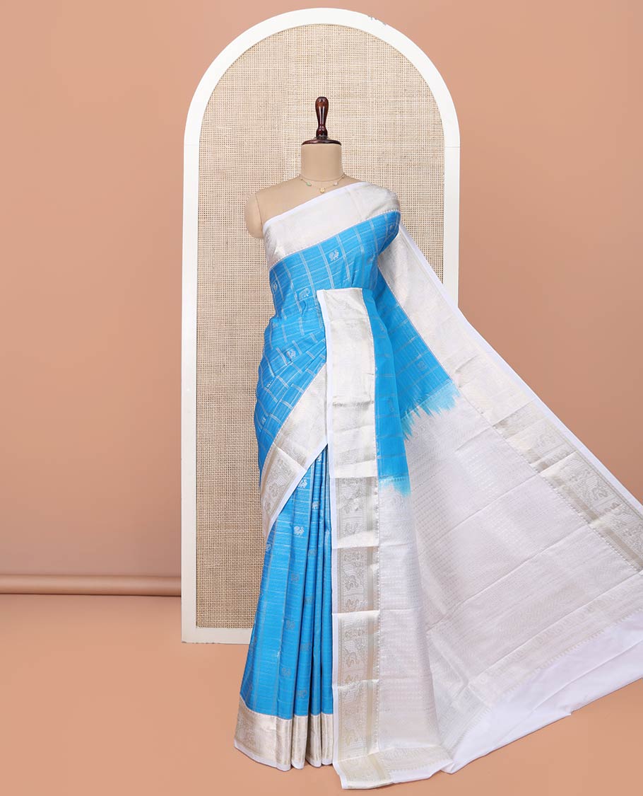Blue Budget Silk Saree, Beautified with Peacock and Elephant Buttas Enclosed Checks All Over Its Body, Complemented by a Contrast Traditional Zari Design Border, Grand Pallu of Jaal Designs, and Paired with a Contrast Blouse