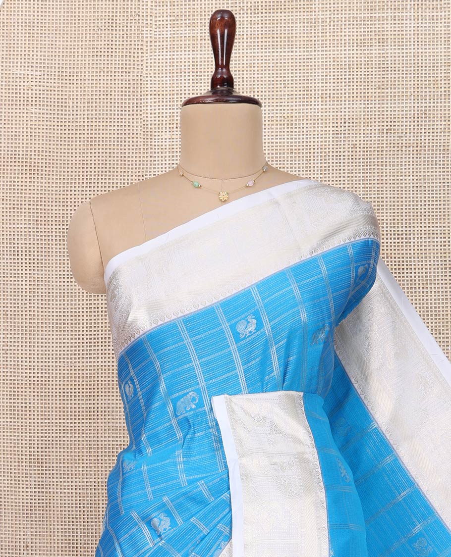 Blue Budget Silk Saree, Beautified with Peacock and Elephant Buttas Enclosed Checks All Over Its Body, Complemented by a Contrast Traditional Zari Design Border, Grand Pallu of Jaal Designs, and Paired with a Contrast Blouse