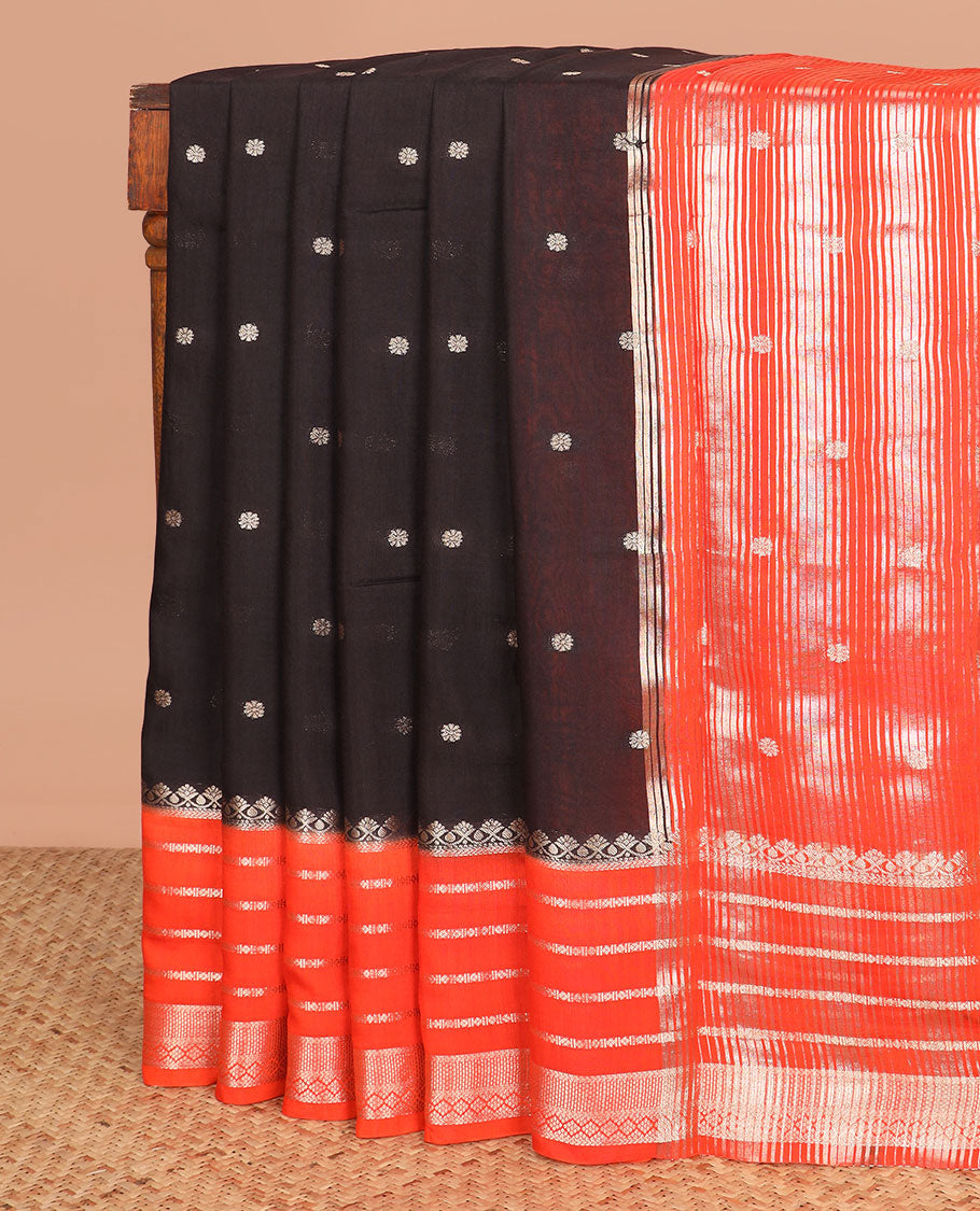 Black floral buttas assam silk saree, contrast traditional zari border, and pallu of stripes and zari buttas