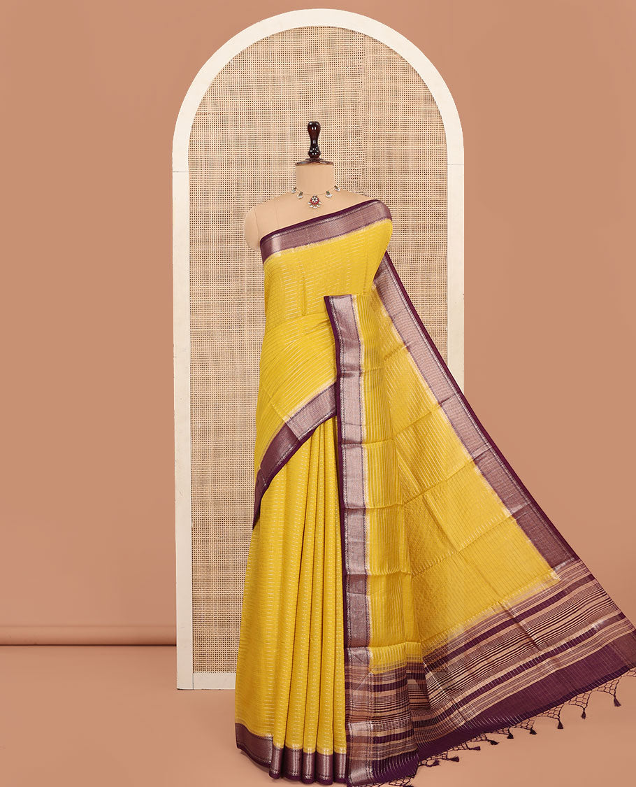 Yellow Assam Silk Saree, Sparsely Sparkled with Zari Stripes, Complemented by Contrast Zari Border of Traditional Designs, Pallu Features Zari Stripes, and Paired with a Contrast Blouse