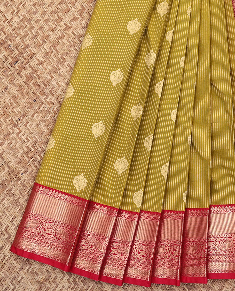 Green Budget Silk Saree, Beautifully Bedecked with Buttas All Over Its Body, Complemented by a Contrast Traditional Zari Border of Paisley Designs, Grandly Detailed Pallu, and Paired with a Contrast Blouse