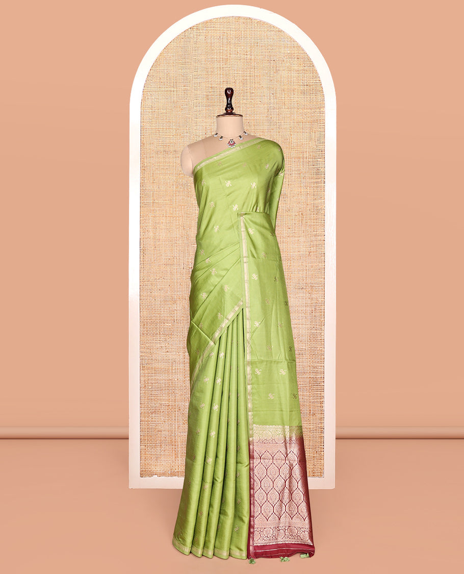 Leaf Green Satin Silk Saree, Enthralled with Zari Buttas, a Subtle Piping Border, Complemented by a Contrast Intricately Designed Pallu, and a Contrast Blouse