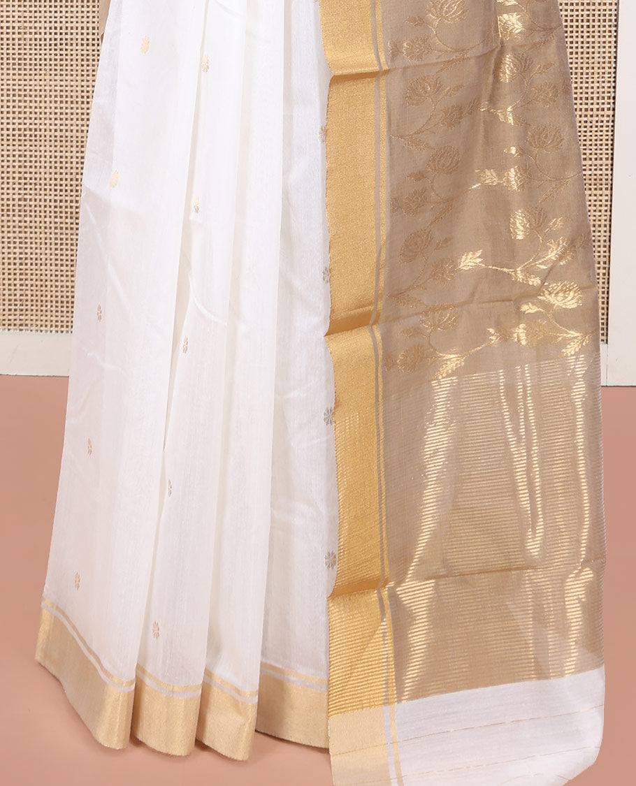 Cream Chanderi Cotton Saree, Graced with Buttas All Over Its Body, Highlighted by a Bavanji Border, Captivating Contrast Pallu of Floral Jaal Designs, and Paired with a Contrast Blouse