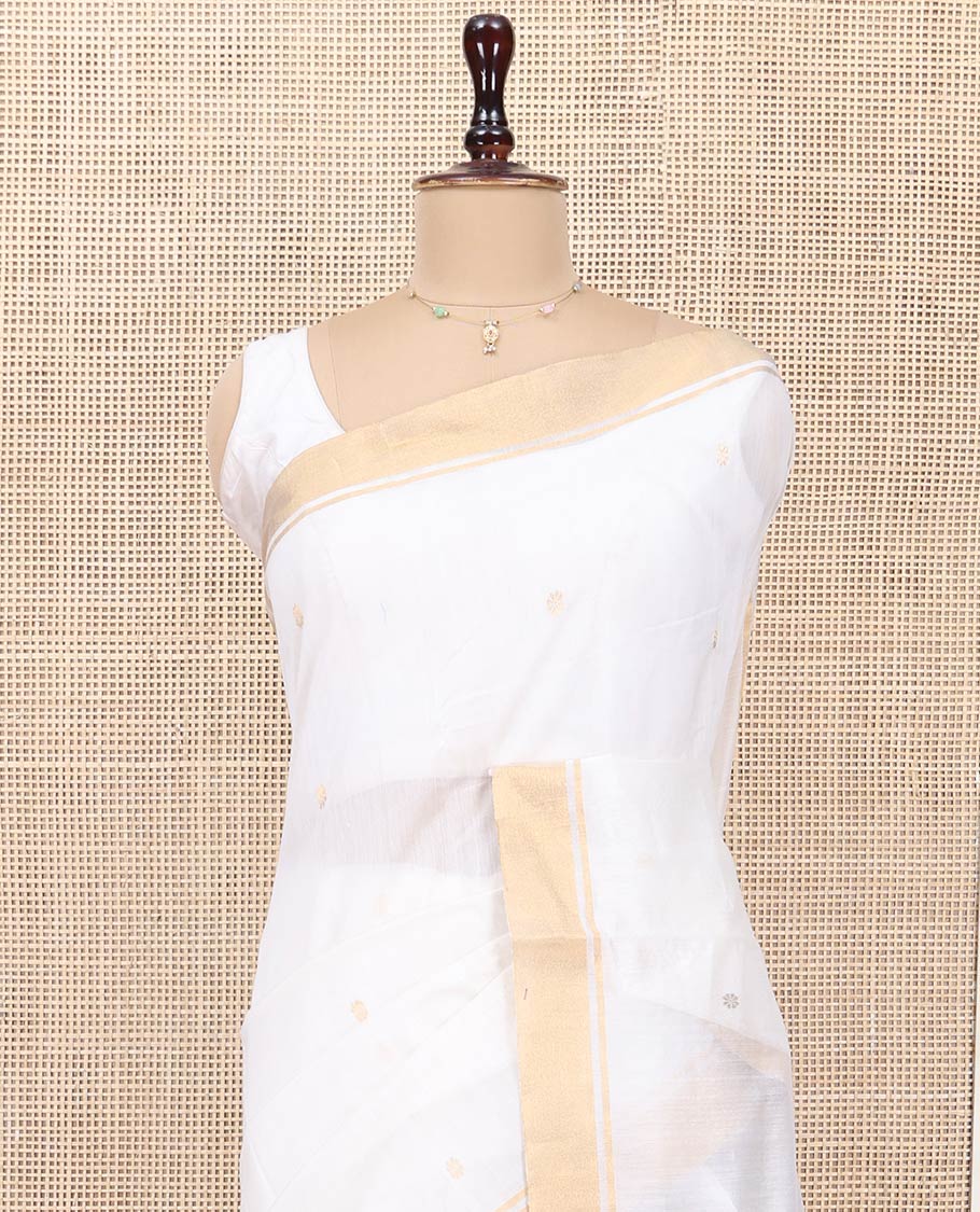 Cream Chanderi Cotton Saree, Graced with Buttas All Over Its Body, Highlighted by a Bavanji Border, Captivating Contrast Pallu of Floral Jaal Designs, and Paired with a Contrast Blouse