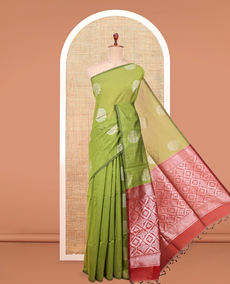 Borderless Parrot Green Semi-Silk Cotton Saree, Elevated with Zari Buttas All Over Its Body, Complemented by a Contrast Pallu of Jaal Designs, and Paired with a Contrast Blouse