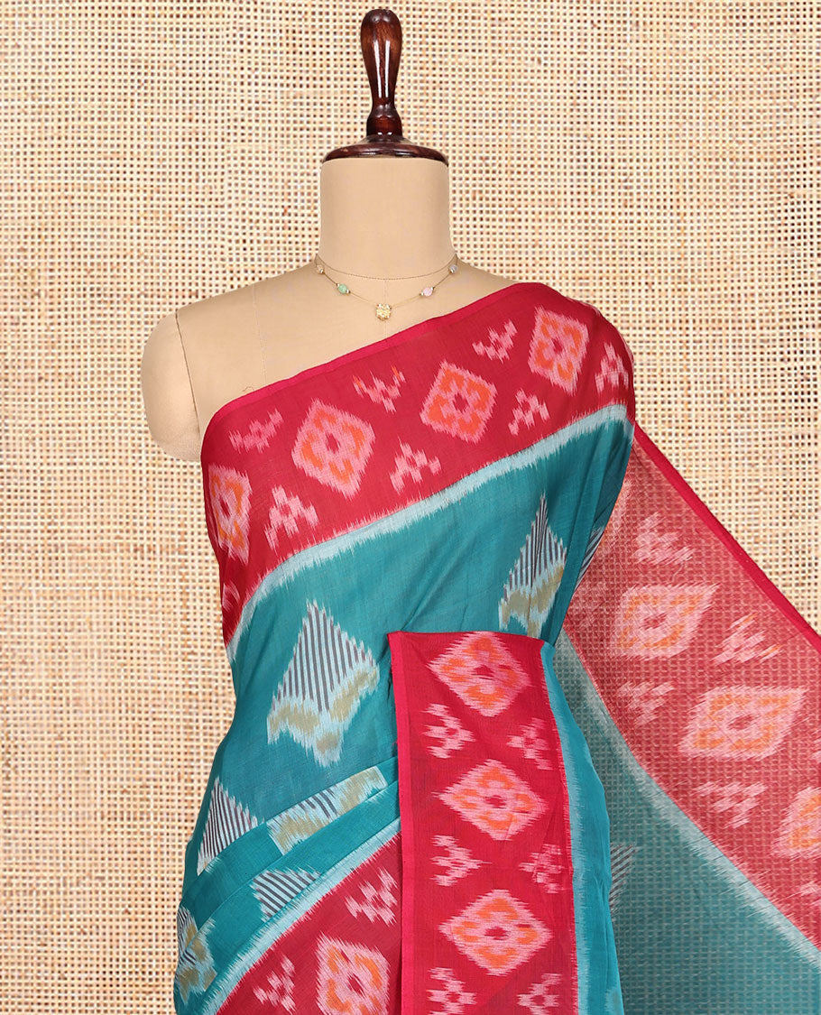 Blue Ikkat Cotton Saree, Decorated with Ikkat-style Buttas All Over Its Body, Complemented by a Contrast Ikkat-Textured Border, Pallu of Butta Enclosed Checks, and Paired with a Contrast Blouse