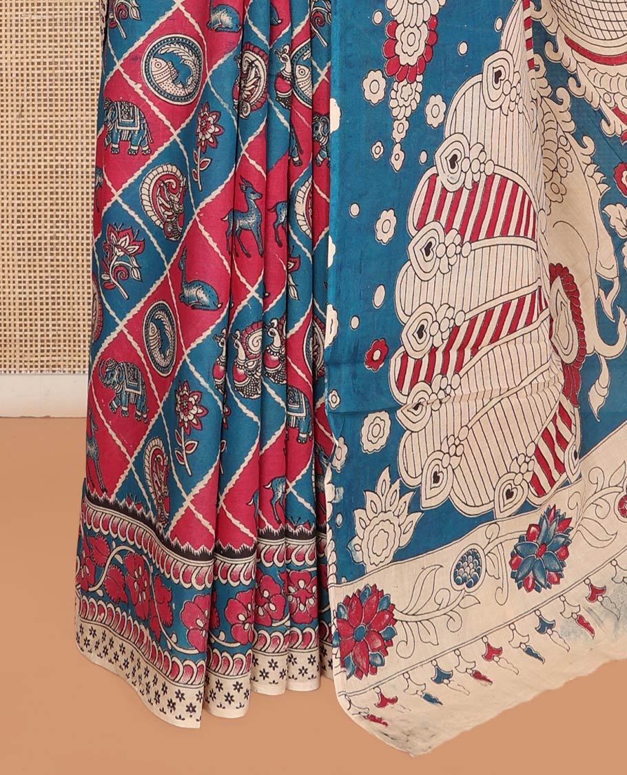 Blue Machine-Printed Kalamkari Cotton Saree Features Butta Enclosed Jaal, Floral Printed Border, Pallu of Peacocks, and a Contrast Blouse